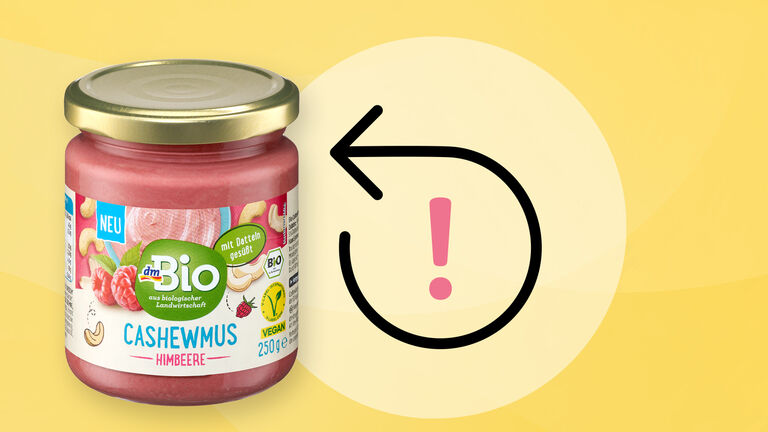 Ein Glas mit dmBio Cashewmus Himbeere ist abgebildet. Daneben ist ein Symbol eines gebogenen Pfeils, der vom Ausgang des Bogens gesehen zurückweist.